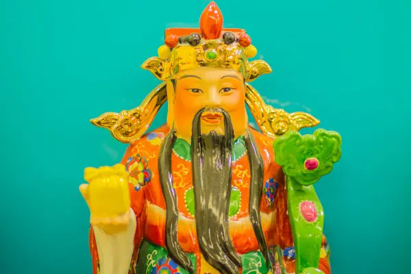 Close up sculpture of Cai Shen