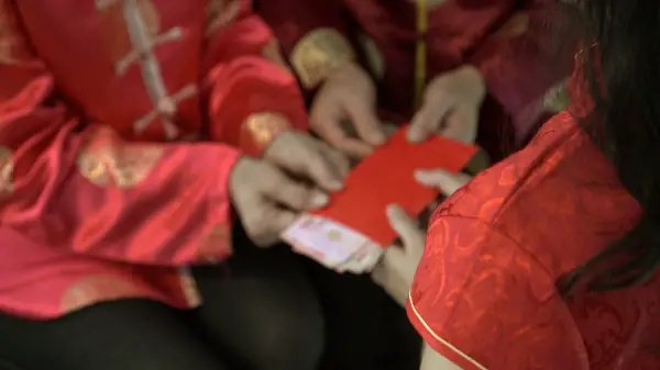 Giving red envelop for Chinese New Year