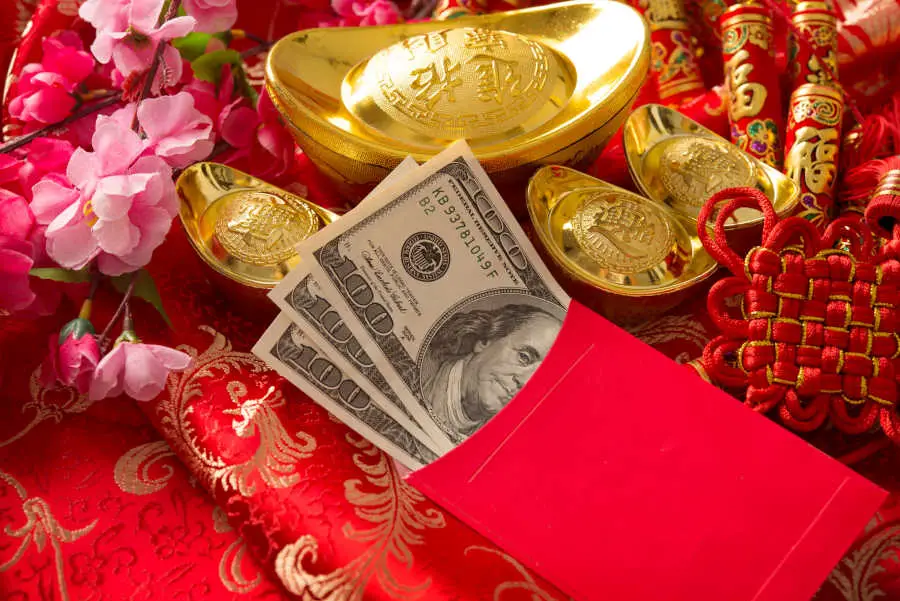 Feng shui wealth corner: Chinese new year red packet with dollars inside