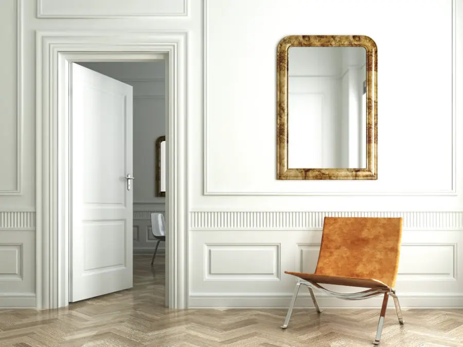 Mirrors in Feng Shui -Classic white interior witn chair mirrors and open door