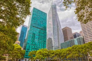 Surrounding buildings and skyscrapers visible from the Bryant Park during the gloomy weather in Manhattan, New York