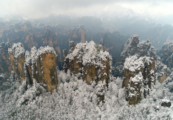 Aerial view of sea of clouds over the snow-covered mountains at Wulingyuan Scenic and Historic Interest Area in Zhangjiajie city of central China's Hubei Province, 23 February 2017. Aerial photo taken on 23 February 2017 showed sea of clouds over the snow-covered mountains at Wulingyuan Scenic and Historic Interest Area in Zhangjiajie city of central China's Hubei Province, which looks like a Chinese painting.