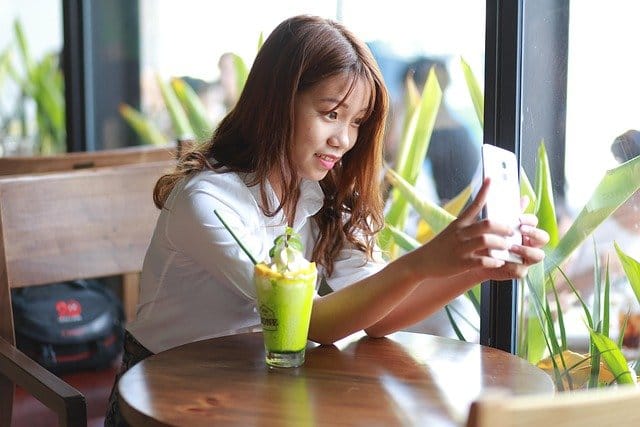Chinese woman checking her mobile